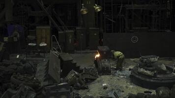 An Industrial Workshop Setting features dynamic sparks and extensive machinery at work. Stock Clip photo