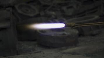 A Flame Torch used in an Industrial Setting specifically for intricate Metalworking tasks. Stock Clip photo