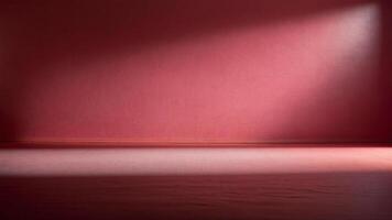 An empty room with a red wall and a light photo