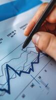 Businessman analyzing investment charts on a virtual screen. Stock market concept. photo