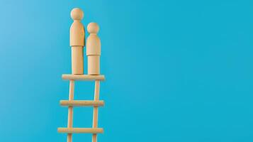 Businessman standing on ladder on blue background. Concept of career growth photo