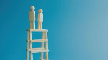 Businessman standing on ladder on blue background. Concept of career growth photo