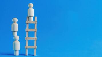 Businessman standing on ladder on blue background. Concept of career growth photo
