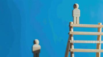 Businessman standing on ladder on blue background. Concept of career growth photo