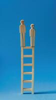 Businessman standing on ladder on blue background. Concept of career growth photo
