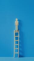 Businessman standing on ladder on blue background. Concept of career growth photo