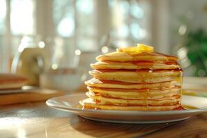 A tall stack of pancakes perfect for a family breakfast with a shallow depth of field and an empty area for additional content photo