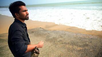 Contemplative Man Standing on the Beach video
