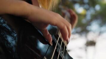 Hands Girl Plays Bass Musical Instrument In Mountains Among Trees Nature video