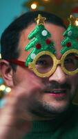 Man Makes Call With Phone Against Christmas Tree Background In Home video