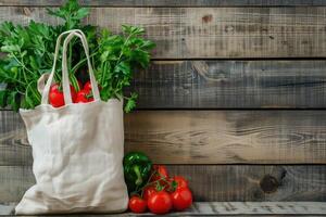 White linen bag with vegetables is placed on a rustic wooden background photo