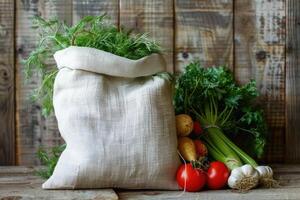 White linen bag with vegetables is placed on a rustic wooden background photo