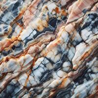 A close up of a marble. A picture of a rock face. Layered rock surface with distinct cracks and varying shades of gray photo