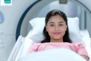 A tomographic scan in progress - a Hindu woman undergoes a radiology procedure for disease detection photo