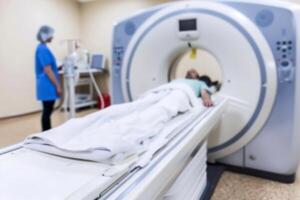 A patient undergoes a CT procedure, with a specialist ensuring accurate imaging for cancer or brain diagnosis, blurred photo