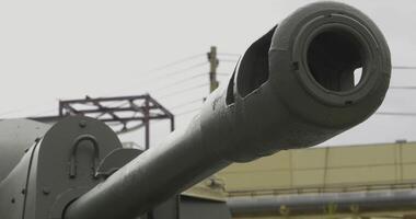 A dramatic sequence highlights a tanks power in an urban setting photo