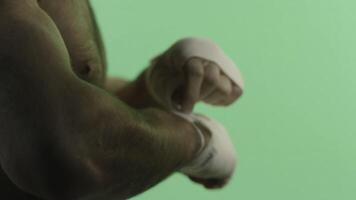 An Intense CloseUp of Boxing Preparation Featuring a Bandaged Hand Ready for Action photo
