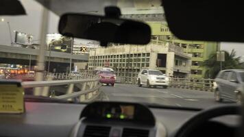 The shows a vehicle navigating busy urban traffic to highway photo