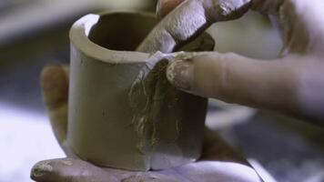 Crafting Pottery A Close Up Examination of the Detailed Process of Hand working Clay by Artisans. Stock Clip photo