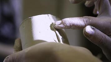 A close up showcasing the intricate craftsmanship of pottery and clay shaping techniques. Stock Clip photo