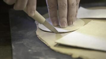 Skillfully Crafting Leather Patterns Utilizing Precision Tools for Exceptional Results. Stock Clip photo