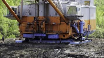 Tbilisi, Georgia - August 02, 2024. Heavy machinery effectively operates in marshy and challenging terrain conditions today. Stock Clip photo