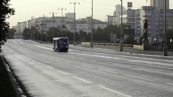 A Serene and Lonely City Street at Dawn Featuring a Bus Surrounded by the Calm Atmosphere. Stock Clip photo