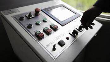 An Industrial Control Panel that features both a Touch Screen Interface and Physical Buttons. Stock Clip photo