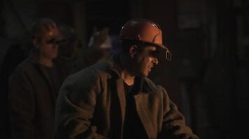 Workers in an Industrial Setting Skillfully Handling Heavy Equipment with Focus and Safety. Stock Clip photo
