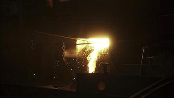 Molten metal is being poured in an industrial foundry, highlighting craftsmanship and innovation. Stock Clip photo