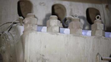 A Close Up View of Intricate Mechanical Components Covered in Dust and Grime Rests. Stock Clip photo