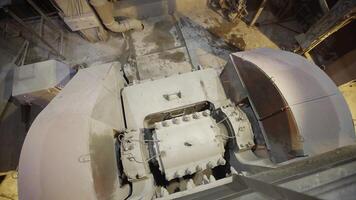 Industrial Machinery in Operation with Dust Presence and Material Flow Dynamics Observed. Stock Clip photo