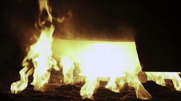 A Fiery Blaze Emanates from the Molten Metal Pouring in a Fiery Workshop Setting. Stock Clip photo