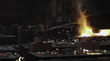 Metalworking in a Foundry The Safe and Precise Process of Pouring Molten Metal Efficiently. Stock Clip photo