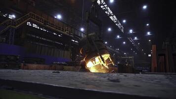 A glimpse into an Industrial Foundry showcasing the impressive process of Molten Metal in Action. Stock Clip photo