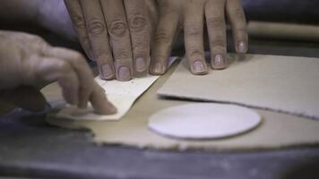 Hands Engaged in the Art of Working on Pottery Crafting and Exploring Techniques. Stock Clip photo