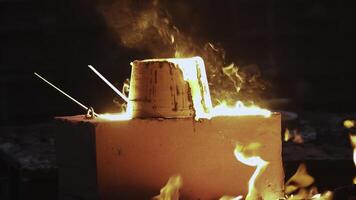 Metal Casting Process Involves the Pouring of Molten Steel into Molds for Shaping Objects. Stock Clip photo