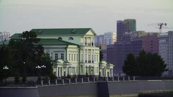 A Historic Building with a Modern Skyline in the Background, Creating a Unique Visual Contrast. Stock Clip photo