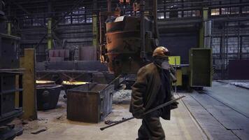Workers in an Industrial Factory Making Use of Heavy and Advanced Machinery on Site. Stock Clip photo