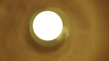 Stunning Illuminated Ceiling Light that Radiates Warmth Against a Beautiful Background. Stock Clip photo