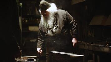 The Art and Craftsmanship Displayed in the Forge A Blacksmith Diligently at Work on His Craft. Stock Clip photo