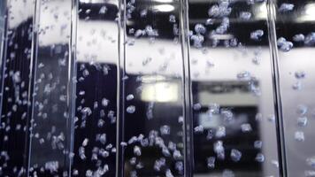 An Artistic Abstract Bubble Reflection onto a Liquid Surface with a Variety of Elements. Media photo