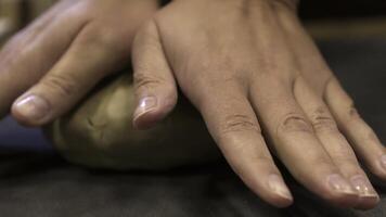 Hands are skillfully shaping clay in a pottery workshop where creativity blends with craft. Stock Clip photo