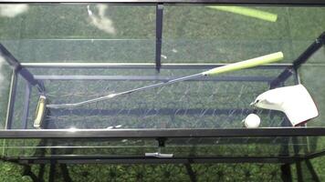 A Comprehensive Golf Practice Setup Featuring Various Accessories on Display for Use photo