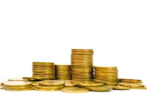 Pile of golden money coin on white background. Business, profit and financial concept. photo