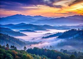 Enchanting layers of mist covered hills and colorful skies at dawn creating a tranquil landscape wallpaper background. photo