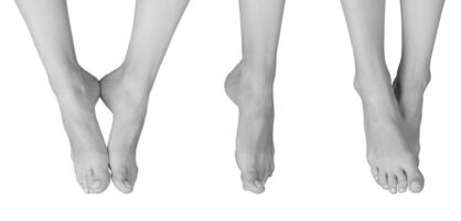 Grayscale view of barefoot female legs in a front position. Slim and smooth legs with neat nails, photo