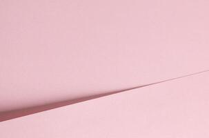 Pink paper background with a soft matte texture and subtle gradient. Minimalistic and elegant design photo