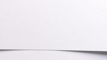 White matte paper background with a fine grainy texture and clean horizontal layout. Featuring photo