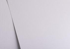 White matte paper background with a smooth texture and clean surface. Featuring fine folds and a photo